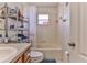 Full bathroom with tub shower combo and wood vanity at 8556 Southern Charm Cir, Brooksville, FL 34613