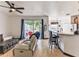 Open living space with hardwood floors and kitchen bar at 8556 Southern Charm Cir, Brooksville, FL 34613