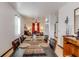 Dining room with hardwood floors, a large table, and views to living areas at 8556 Southern Charm Cir, Brooksville, FL 34613