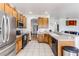 Open concept kitchen with island and stainless steel appliances at 8556 Southern Charm Cir, Brooksville, FL 34613