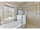 Bathroom with a walk-in shower and garden tub at 8556 Southern Charm Cir, Brooksville, FL 34613