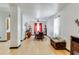 Dining room with hardwood floors, a large table, and red curtains at 8556 Southern Charm Cir, Brooksville, FL 34613