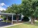 Exterior view showing building and carport at 62 Emerald Bay Dr, Oldsmar, FL 34677