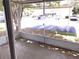 Screened porch with view of parking lot and other units at 62 Emerald Bay Dr, Oldsmar, FL 34677