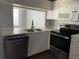 Kitchen with stainless steel appliances and white cabinets at 62 Emerald Bay Dr, Oldsmar, FL 34677