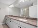 Double vanity bathroom with granite countertops at 2505 Arch Ave, Oldsmar, FL 34677