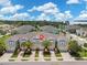 Three-unit townhouse building with light blue exterior at 2505 Arch Ave, Oldsmar, FL 34677