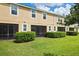 Townhouse backyard with screened patio and lawn at 2505 Arch Ave, Oldsmar, FL 34677