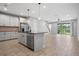 Modern kitchen with island, stainless steel appliances, and tile floors at 2505 Arch Ave, Oldsmar, FL 34677