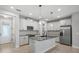 Modern kitchen with stainless steel appliances and granite countertops at 2505 Arch Ave, Oldsmar, FL 34677