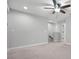 Bright and airy bedroom with carpeted floors and ceiling fan at 2505 Arch Ave, Oldsmar, FL 34677