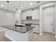 Island kitchen with white cabinets and granite countertops at 2505 Arch Ave, Oldsmar, FL 34677