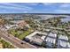 Aerial view of a building near water, showing its proximity to other houses and a park at 16333 Gulf Blvd # 206, Redington Beach, FL 33708