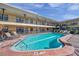 Refreshing community pool area with lounge chairs at 16333 Gulf Blvd # 206, Redington Beach, FL 33708