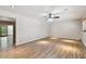 Large living room with hardwood floors and ceiling fan at 1618 Valencia St, Clearwater, FL 33756