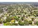 Aerial view showcasing the property's location in a residential neighborhood with mature trees at 1618 Valencia St, Clearwater, FL 33756