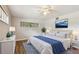 Main bedroom with wood floors and ceiling fan at 1618 Valencia St, Clearwater, FL 33756