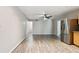 Spacious dining area with wood-look flooring and access to kitchen at 1618 Valencia St, Clearwater, FL 33756