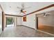 Open living area with hardwood floors and kitchen passthrough at 1618 Valencia St, Clearwater, FL 33756