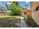 Peaceful backyard with a walkway leading to a shed at 1618 Valencia St, Clearwater, FL 33756