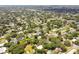 Aerial view showing property's location in a residential neighborhood with mature trees at 1618 Valencia St, Clearwater, FL 33756