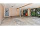 Covered carport with concrete flooring and storage area at 1618 Valencia St, Clearwater, FL 33756