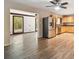 Bright kitchen featuring stainless steel refrigerator and wood cabinets at 1618 Valencia St, Clearwater, FL 33756