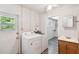 Laundry room with washer, dryer, and access to bathroom at 1618 Valencia St, Clearwater, FL 33756