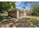 Midcentury ranch home with mature landscaping at 1618 Valencia St, Clearwater, FL 33756