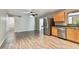 Modern kitchen with stainless steel appliances and light wood cabinets at 1618 Valencia St, Clearwater, FL 33756