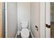 Simple toilet and storage in small bathroom at 1618 Valencia St, Clearwater, FL 33756