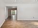 Spacious living room with wood-look floors and neutral color scheme at 1618 Valencia St, Clearwater, FL 33756