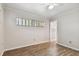 Bright bedroom with wood-look flooring and window at 1618 Valencia St, Clearwater, FL 33756