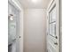 Clean entryway with white door and view into laundry area at 1618 Valencia St, Clearwater, FL 33756