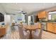 Open concept kitchen with stainless steel appliances and wood cabinets at 1618 Valencia St, Clearwater, FL 33756
