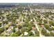 Aerial view showing property's location in a residential neighborhood with mature trees at 1618 Valencia St, Clearwater, FL 33756