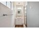 Small bathroom with single sink vanity and a mirror at 1618 Valencia St, Clearwater, FL 33756