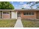 Inviting exterior featuring a walkway to the entrance of the home at 1618 Valencia St, Clearwater, FL 33756