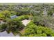Aerial view of property, showcasing surrounding houses and lush green landscape at 1618 Valencia St, Clearwater, FL 33756