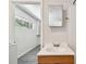 Bathroom with vanity and view of laundry area at 1618 Valencia St, Clearwater, FL 33756
