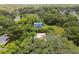 Aerial view showing home's location in a residential neighborhood with mature trees at 1618 Valencia St, Clearwater, FL 33756