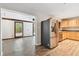Modern kitchen with stainless steel refrigerator and wood flooring at 1618 Valencia St, Clearwater, FL 33756