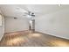 Large living area with hardwood floors and ceiling fan at 1618 Valencia St, Clearwater, FL 33756