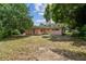 Single story home with a large backyard and mature landscaping at 1618 Valencia St, Clearwater, FL 33756