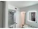 Updated bathroom with shower, toilet and vanity at 2994 Mission E Dr, Clearwater, FL 33759