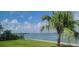 Relaxing waterfront view with palm trees at 447 129Th E Ave, Madeira Beach, FL 33708