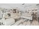 Large living room with sectional sofa and kitchen views at 5690 Bayview Dr, Seminole, FL 33772