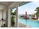 Relaxing pool area with water access and patio seating at 5690 Bayview Dr, Seminole, FL 33772