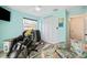 Bright and airy home gym with a rowing machine and plenty of natural light at 5690 Bayview Dr, Seminole, FL 33772