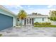 House exterior with a welcoming entrance and landscaping at 5690 Bayview Dr, Seminole, FL 33772